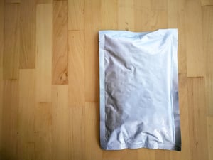 thick-aluminium-foil-bag-on-a-wooden-background-2021-08-30-06-59-36-utc